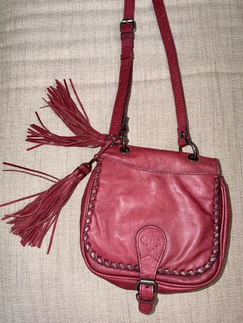 Patricia Nash Karis Leather Whipstitch Saddle Bag in a rich red/berry